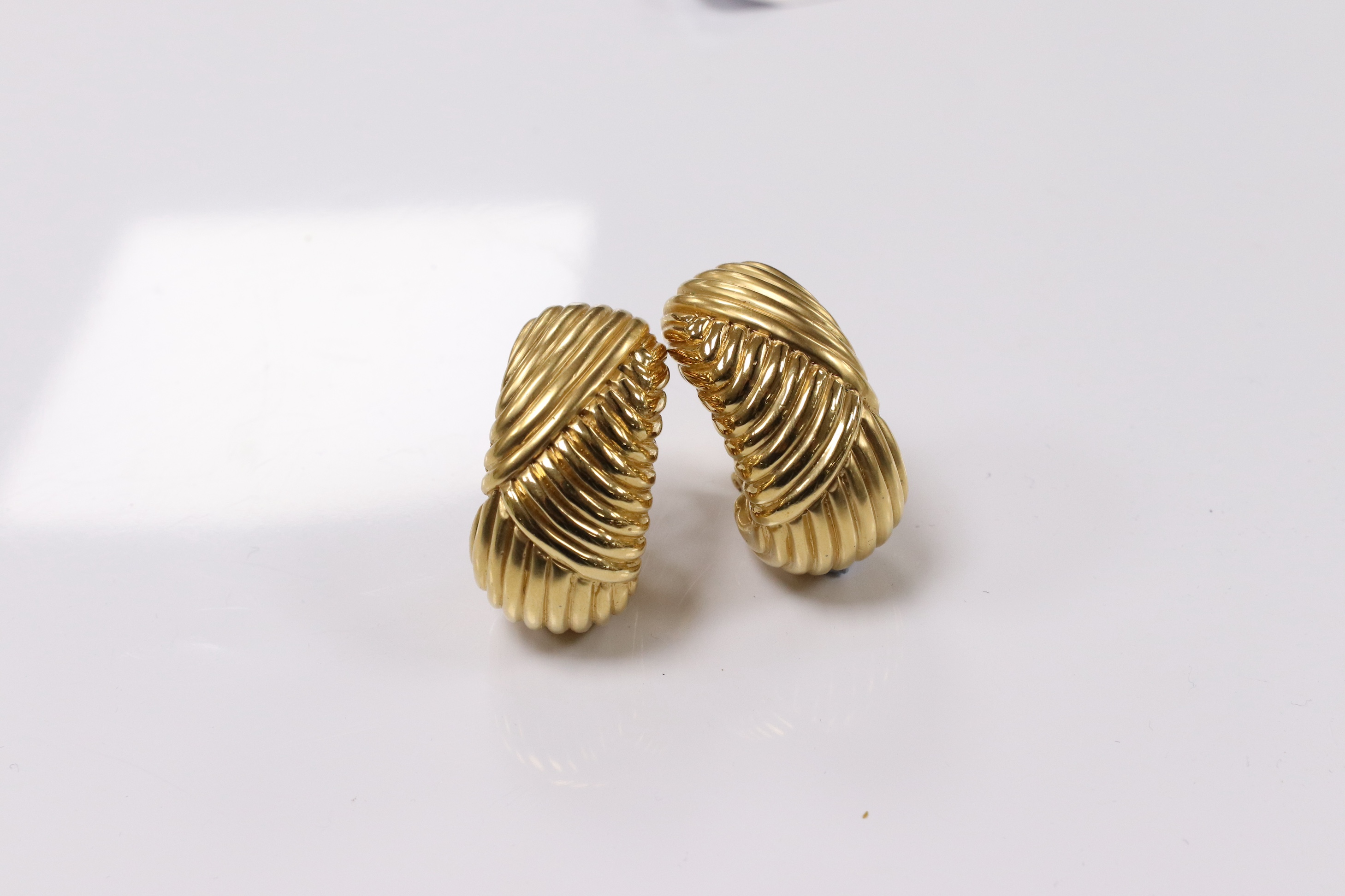 A pair of Valentino gold plated fluted demi-lune ear clips, 36mm. Condition - fair